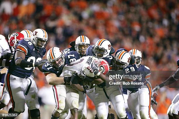 College Football: Georgia Thomas Brown in action during pileup tackle vs Auburn defense, Auburn, AL