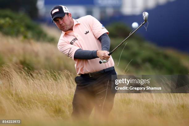 Richie Ramsay of Scotland hits from the rough on the 18th hole during day two of the AAM Scottish Open at Dundonald Links Golf Course on July 14,...