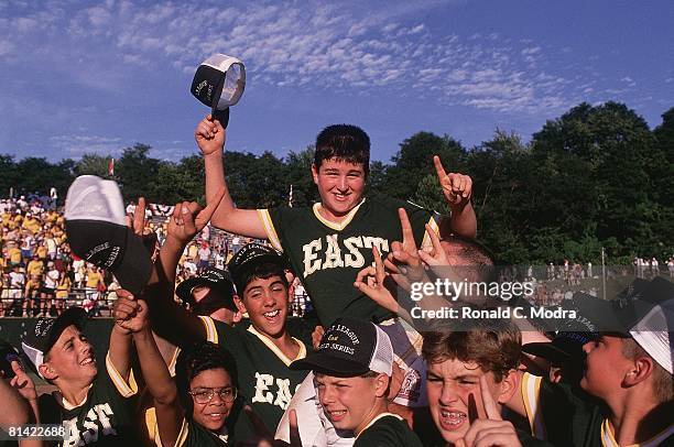 Youth Baseball: Little League World Series, East Chris Drury victorious, getting carried on shoulders of team during celebration and after winning...