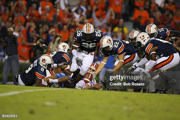 College Football: Auburn Tre Smith , Steve Gandy , Jerraud Powers and Tristan Davis in action, recovering blocked punt vs Florida Eric Wilbur ,...