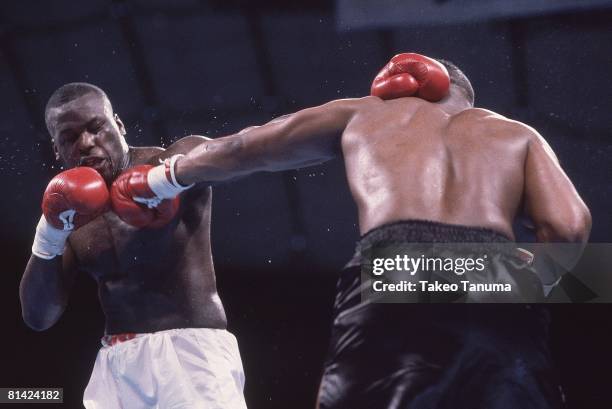 Boxing: WBC/WBA/IBF Heavyweight Title, James Buster Douglas in action, throwing punch vs Mike Tyson at Tokyo Dome, Tokyo, Japan 2/11/1990