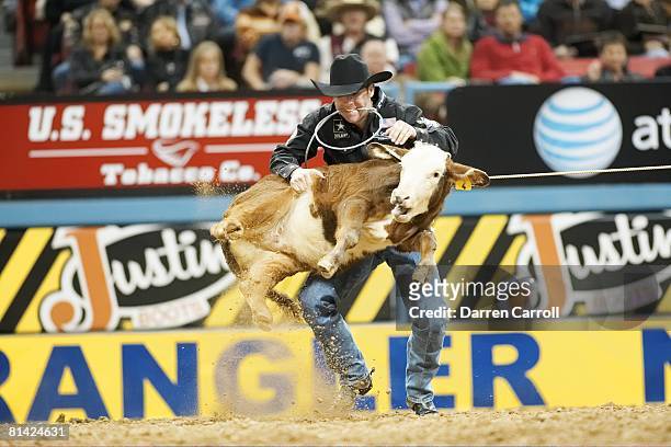 Rodeo: National Finals Rodeo, Trevor Brazile in action, securing calf during 9th Round of Tie-down Roping Event at Thomas & Mack Center, Brazile...