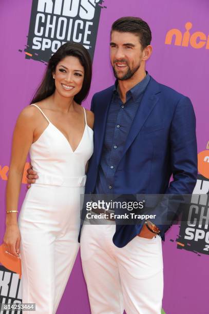 Honoree Michael Phelps and Nicole Johnson attend Nickelodeon Kids' Choice Sports Awards 2017 at Pauley Pavilion on July 13, 2017 in Los Angeles,...