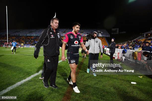 Shaun Johnson of the Warriors walks off the field after picking up an injury during the round 19 NRL match between the New Zealand Warriors and the...