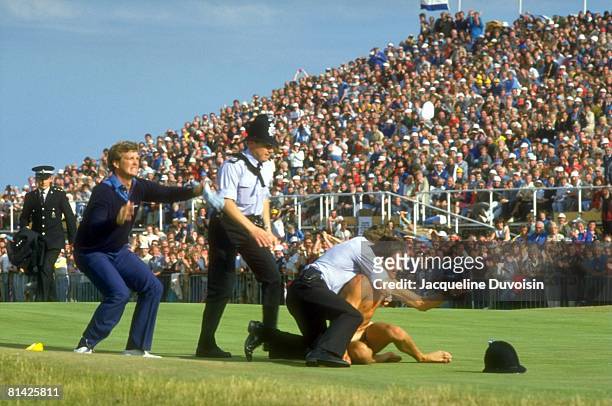 Golf: British Open, Police officers subduing streaker on No, 18 green after Peter Jacobsen tackle during Sunday play at Royal St, George's, Sandwich,...