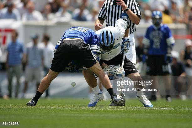 College Lacrosse: NCAA finals, Johns Hopkins Jamison Koesterer in action during faceoff vs Duke Brad Ross , Philadelphia, PA 5/30/2005