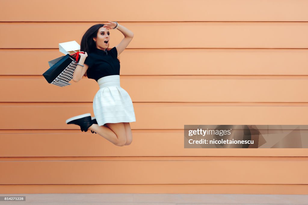 Surprised Woman Running With Shopping Bags in Summer Sale Season