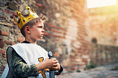 Portrait of young king at the castle walls