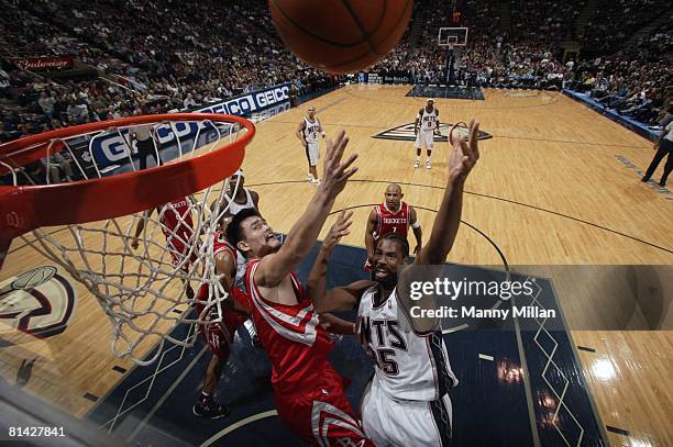 Basketball: New Jersey Nets Jason Collins in action vs Houston Rockets Yao Ming , East Rutherford, NJ