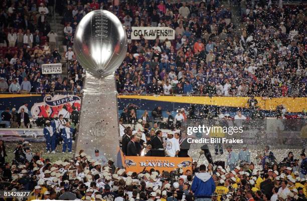 Football: Super Bowl XXXV, Baltimore Ravens victorious near large Lombardi Trophy during celebration after winning game vs New York Giants, Tampa, FL...