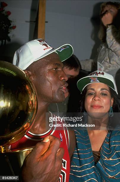 Basketball: finals, Closeup of Chicago Bulls Michael Jordan victorious with wife Juanita and trophy after game vs Los Angeles Lakers, Los Angeles, CA...
