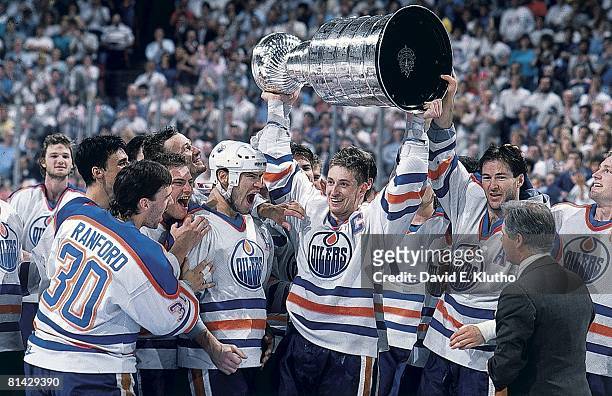 Hockey: Stanley Cup finals, Edmonton Oilers Bill Ranford, Esa Tikkanen, Mark Messier, Wayne Gretzky, and Kevin Lowe victorious with trophy after...