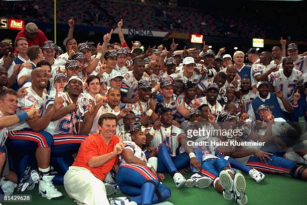 College Football: Sugar Bowl, Florida coach Steve Spurrier victorious with team during portrait after winning national championship game vs Florida...