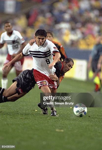 Soccer: MLS Cup, DC United Jaime Moreno in action during tackle vs Los Angeles Galaxy Arash Noamouz , Foxboro, MA