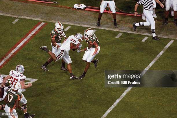 Coll, Football: Fiesta Bowl, Ohio State's Maurice Clarett in action, forcing fumble after Miami's Sean Taylor made interception, Tempe, AZ 1/3/2003