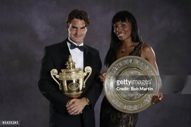 Tennis: Wimbledon, Formal portrait of Switzerland Roger Federer with Gentlemen's Singles trophy and USA Venus Williams with Rosewater Dish trophy...