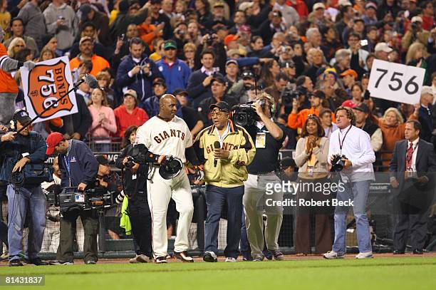 Baseball: San Francisco Giants Barry Bonds victorious with Godfather and former player/ Hall of Famer Willie Mays after hitting 756th career home run...