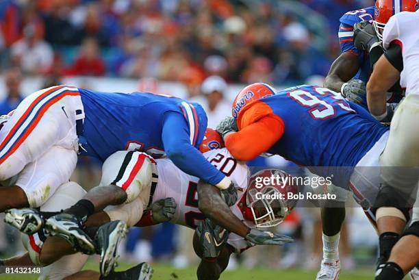 College Football: Georgia Thomas Brown in action during pileup tackle vs Florida, Jacksonville, FL