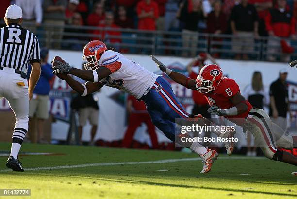 College Football: Florida defensive end Ray McDonald in action, diving into endzone for touchdown after nine-yard run with recovered fumble vs...