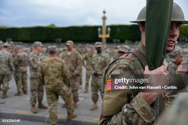 Military personnel take part in rehearsals ahead of Friday's Bastille Day celebrations and military parade on the Avenue des Champs-Élysée on July...