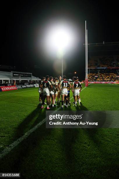 Players of the Panthers huddle during the round 19 NRL match between the New Zealand Warriors and the Penrith Panthers at Mt Smart Stadium on July...