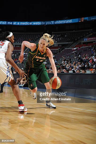 Lauren Jackson of the Seattle Storm drives against Kara Braxton of the Detroit Shock at the Palace of Auburn Hills June 4, 2008 in Auburn Hills,...