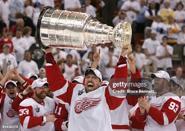 Dallas Drake of the Detroit Red Wings celebrates with the Stanley Cup after defeating the Pittsburgh Penguins in game six of the 2008 NHL Stanley Cup...