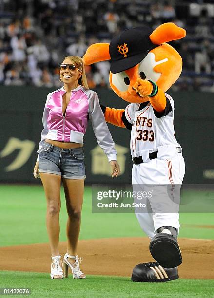 Singer Mariah Carey throws the ceremonial first pitch before Japanese professional baseball match between Yomiuri Giants and Rakuten Golden Eagles at...