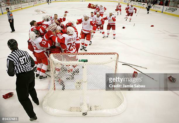 The Detroit Red Wings celebrate after defeating the Pittsburgh Penguins in game six of the 2008 NHL Stanley Cup Finals at Mellon Arena on June 4,...
