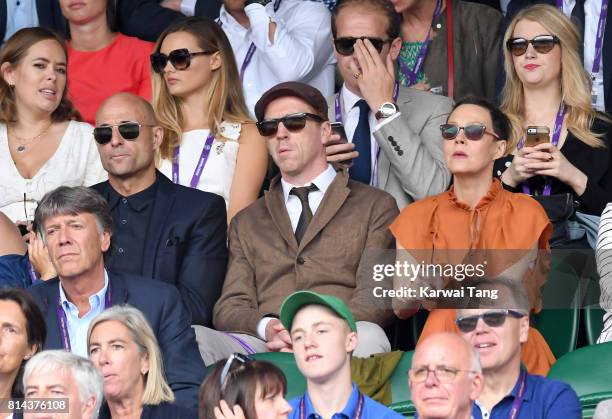 Mark Strong, Damian Lewis and Helen McCrory attend day 11 of Wimbledon 2017 on July 14, 2017 in London, England.