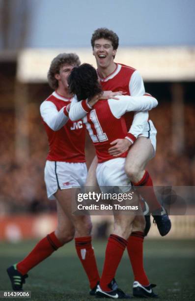 Arsenal's Tony Woodcock is congratulated by Charlie Nicholas and Tommy Caton after scoring against Hereford United in the FA Cup 3rd round at Edgar...