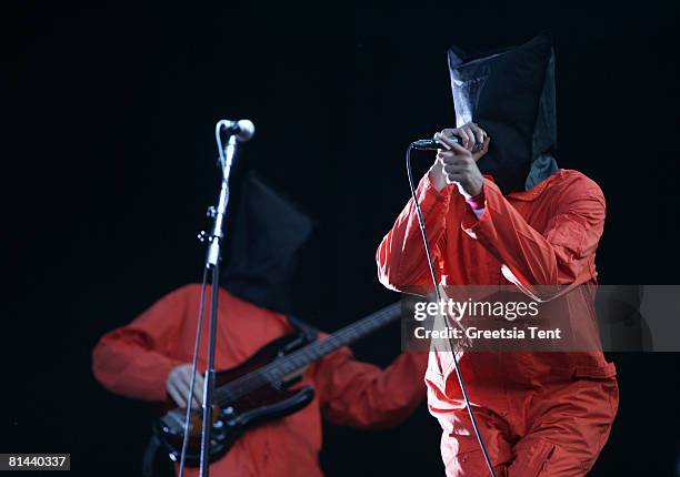 Zack de la Roche of the band Rage Against The Machine dresses up as Guantanamo Bay prisoners, in orange jumpsuits and black hoods in protest to the...