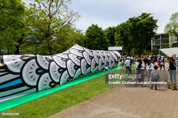 giant koinobori, made so visitors could walk through it, during golden week 2017 in tokyo mid town garden. - ゴールデンウィーク ストックフォトと画像