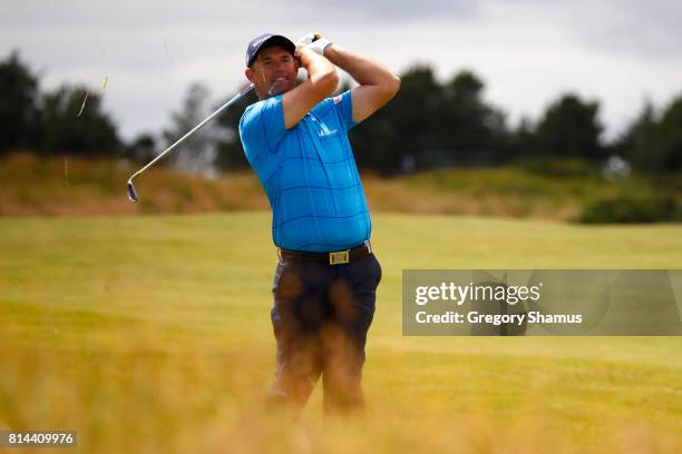 Padraig Harrington of Ireland hits his second shot on the 9th hole during day two of the AAM Scottish Open at Dundonald Links Golf Course on July 14,...