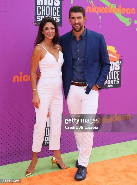 Nicole Johnson and Michael Phelps attend the 2017 Nickelodeon Kids' Choice Sports Awards at Pauley Pavilion on July 13, 2017 in Los Angeles,...