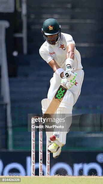 Zimbabwe cricketer Sikandar Raza plays a shot during the first day of the only Test cricket match between Sri Lanka and Zimbabwe at R Premadasa...