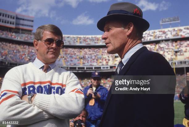 Football: Dallas Cowboys coach Tom Landry with Denver Broncos coach Dan Reeves , Denver, CO 10/5/1986
