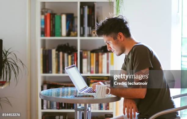 man reading and working at home - proofreading computer stock pictures, royalty-free photos & images
