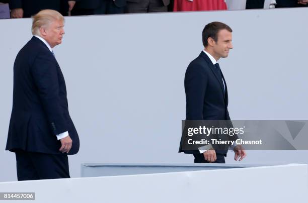 President Donald Trump and French President Emmanuel Macron attend the traditional Bastille day military parade on the Champs-Elysees on July 14,...