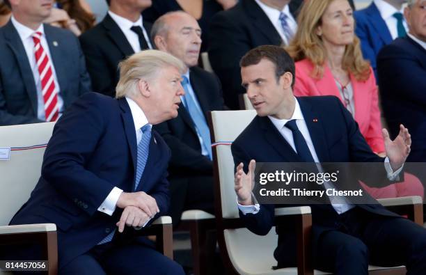 President Donald Trump and French President Emmanuel Macron attend the traditional Bastille day military parade on the Champs-Elysees on July 14,...