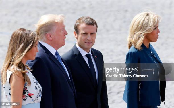 President Donald Trump and his wife Melania Trump, French President Emmanuel Macron and his wife Brigitte Trogneux attend the traditional Bastille...