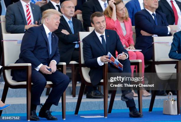 President Donald Trump and French President Emmanuel Macron attend the traditional Bastille day military parade on the Champs-Elysees on July 14,...