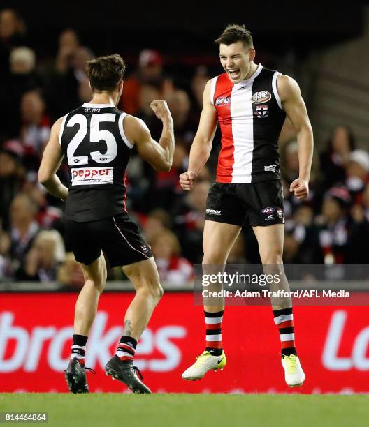 Debutante, Josh Battle of the Saints celebrates his first AFL goal with Koby Stevens of the Saints during the 2017 AFL round 17 match between the St...