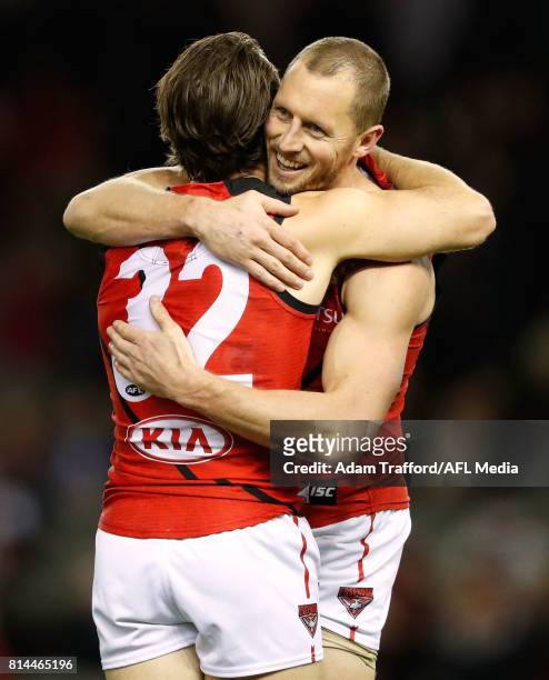 James Kelly of the Bombers celebrates with Travis Colyer of the Bombers on the final siren during the 2017 AFL round 17 match between the St Kilda...