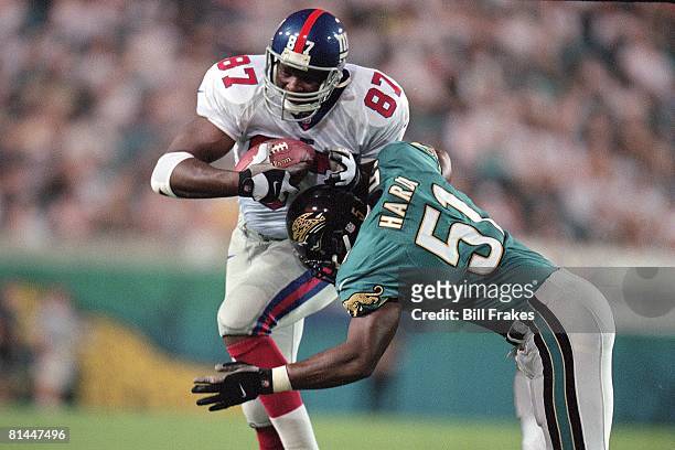 Football: New York Giants Howard Cross in action during tackle vs Jacksonville Jaguars Kevin Hardy during presason, Jacksonville, FL 8/11/2000