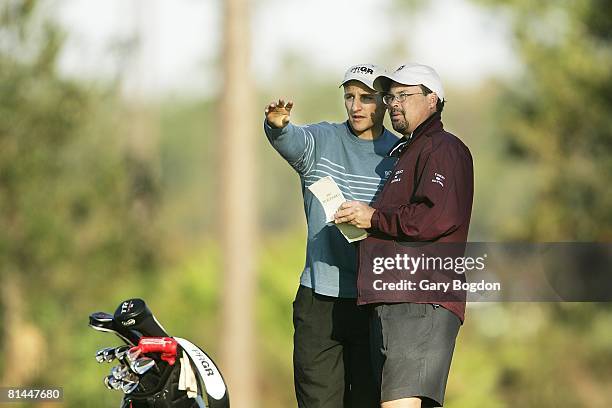 Golf: David Gossett with swing coach Rob Aiken at qualifying tournament, St, Augustine, FL