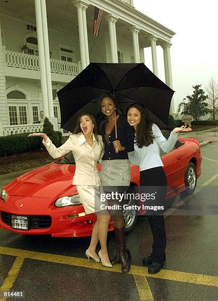 Kimberly Ann Pressler, Miss USA 1999, Wendy FitzWilliam, Miss Universe 1998, and Vanessa Minnillo, Miss Teen USA 1998 pose for photographers at The...