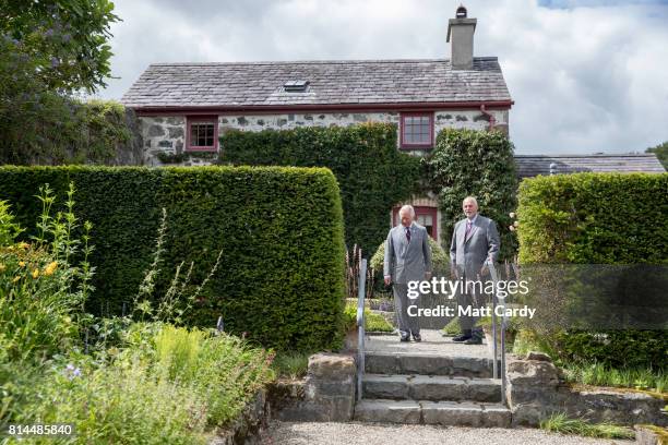 Prince Charles, Prince of Wales accompanied by Anthony Tavernor owner and restorer of the Plas Cadnant Hidden Gardens visits the gardens during The...