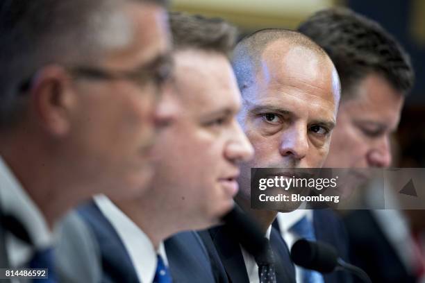 Jonah Crane, former deputy assistant secretary of Financial Stability Oversight Council at the U.S. Treasury, second right, listens during a House...