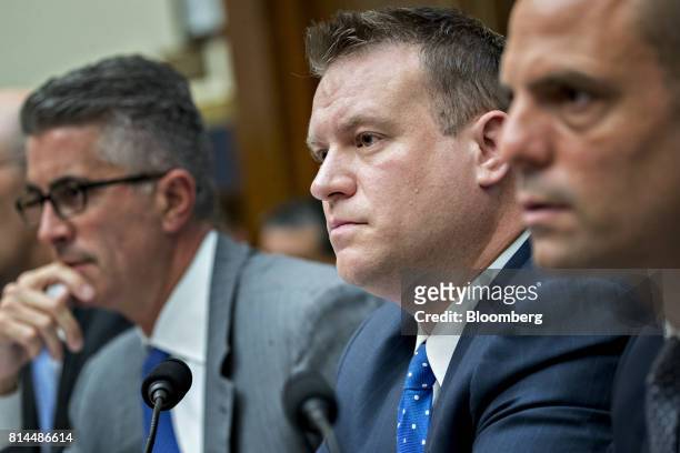 Alex Sedgwick, vice president of fixed income market structure and electronic trading at T. Rowe Price Group Inc., center, listens during a House...